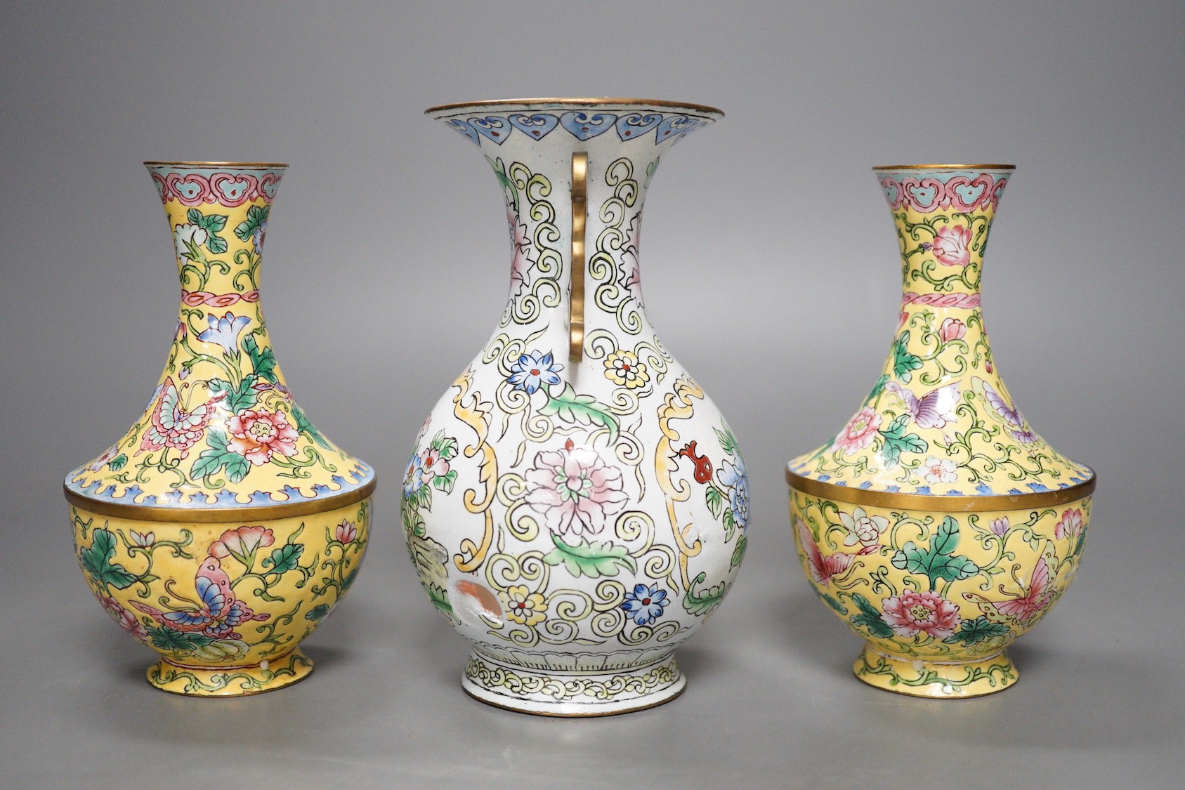 A pair of Chinese Guangzhou yellow enamel vases and another similar vase, tallest 15cms high.